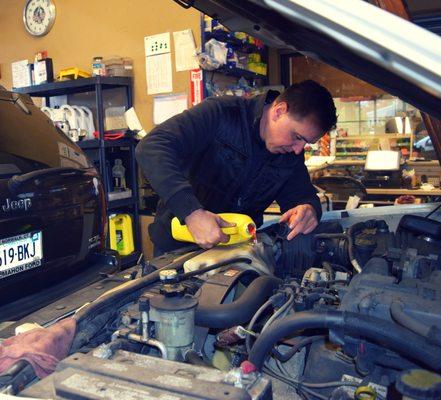 Owner Tony performing an express oil change.