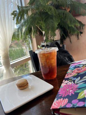 Delicious Salted Caramel Macaron by a sunny window