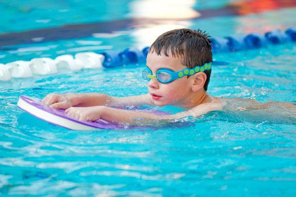 Child taking a swim lesson