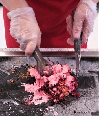 Strawberry ice cream, chips, butterfinger dust, and raspberries, on the slab!