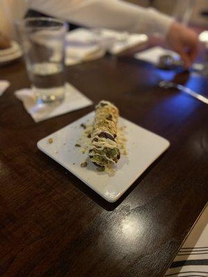 Canoli: drizzled with white chocolate and crushed pistachio