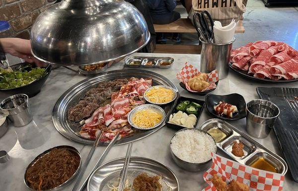 Japchae, corn cheese, spicy rice cake, salad, chicken, dumplings, bulgogi, brisket, etc...