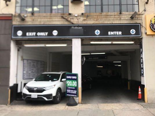 Centerpark 4172 Broadway Garage entrance with clear signage for entry and exit. Convenient parking located next to IHOP and Planet Fitness.