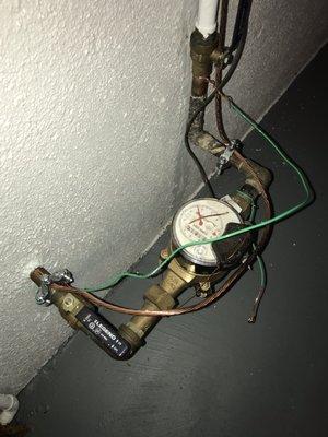 Grounded water meter