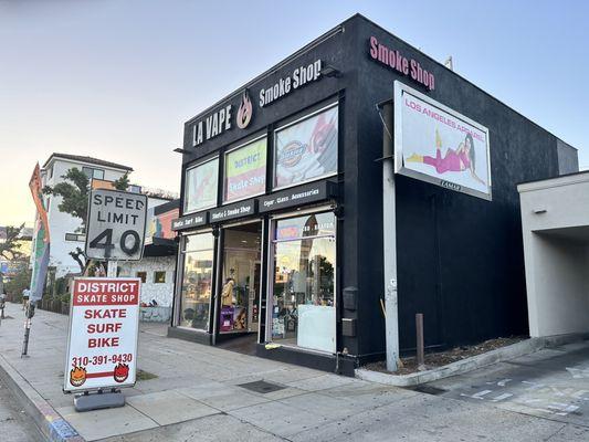 Store front w BIG skate surf n bike sign out front Big Smoke Shop is visible at the top of the front as well top