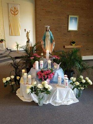 May is for the blessed mother Mary.  Therefore 10 girls and boys made their 1st holy communion today. Candles lit are for each.