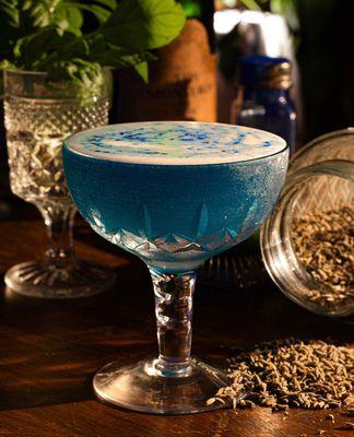 Signature Cocktail:
HIGH TIDE-  Vodka, lavender, lemon, Blue Majik, foamer.