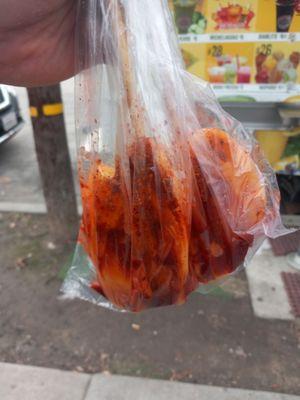 Mango on a stick the mangos they use are some of the best they go out of their way to pick the best fruit