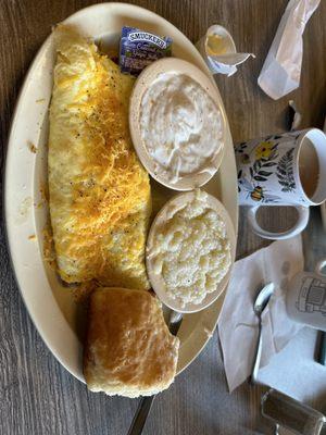 Meat lover's omelette, grits, and biscuit and gravy!