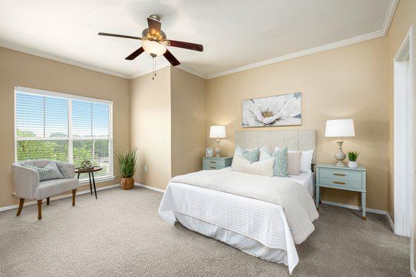 Bedroom with ceiling fan at Villas at Oakwell Farms