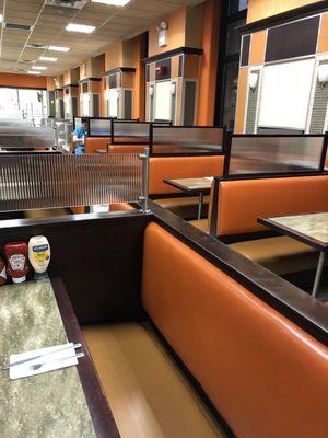 Row of clean booths with windows on the park.