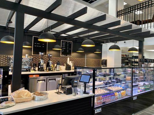 Coffee and baked goods counter at the front of the store