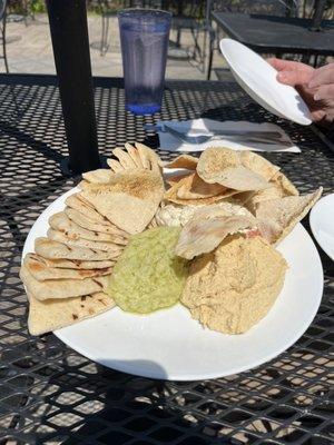 Melitzanosalata (back), skordalia (front left), hummus (front right) dips