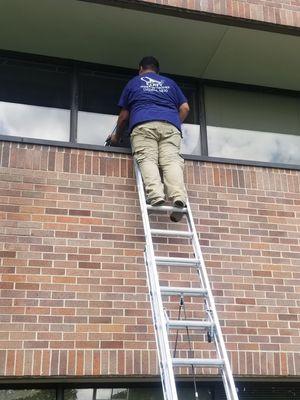 We are washing the windows of a three story building