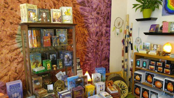 Tarot cards, Oracle cards, and salt lamps.