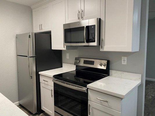 modern kitchen with stainless steel appliances at 100 Union Ave Apartments