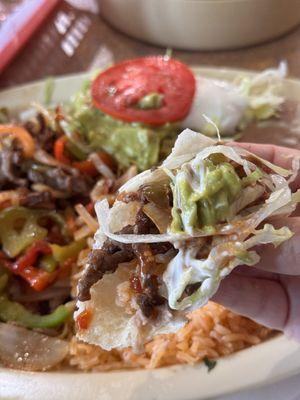 Steak fajitas - perfect bite with everything! (added a little bit of their pickled jalapeño slices and their hot salsa too!)