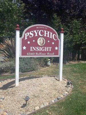 Psychic sign in front of debras office