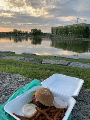 Enjoying my falafel burger to go at a park in North Liberty. I could hear the live music across the pond while I watched the sunset :)