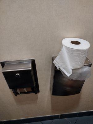 Women's bathroom off the hotel lobby. The toilet paper is on the period blood box, instead of in the toilet paper holder.