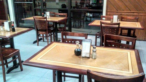 Simple dining tables..other side occupied by owner's family