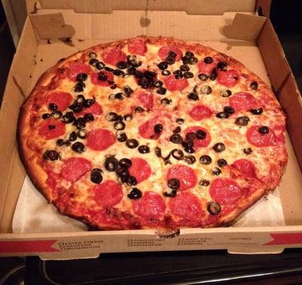 Pepperoni and black olive thin crust pizza