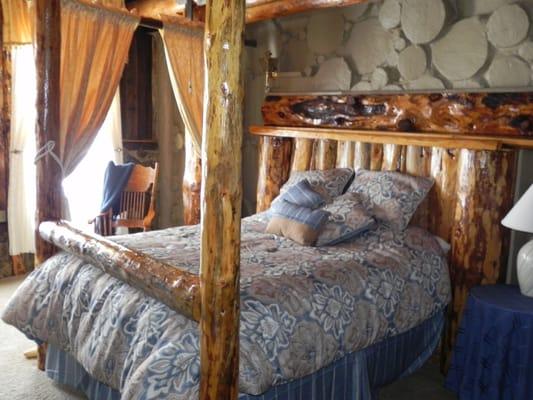 The Tree Room.  Rustic Romantic Room with Queen bed, sitting area, small kitchenette, and Jacuzzi tub.  Each room rate includes breakfast.