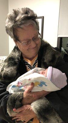 Myrna holding Baby Kinsley