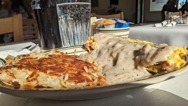 The Farmer Connor omelette includes bacon, ham, sausage, and sausage gravy. It is served with toast and hashbrowns. So good.