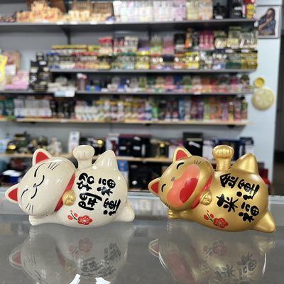 Check out our lucky cats on the counter they often have lucky cat sales