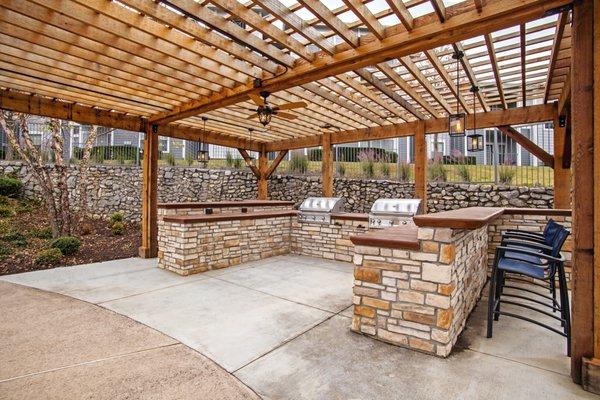 Outdoor grilling area by pool