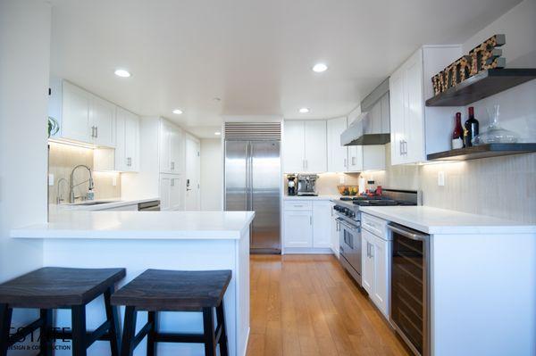 Custom Cabinetry, Quartz Countertops, State-of-the-Art Appliances, Lighting, and Dining Area.