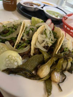 Lengua and tripa tacos x 4