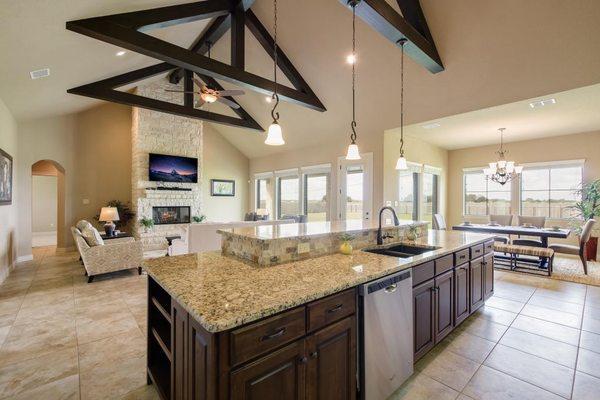 Kitchen island with sink and dishwasher. Beautiful granite counter tops.