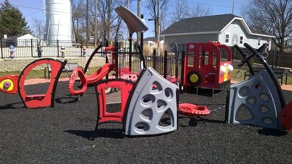 an unusual assortment of playground equipment in the park