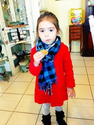 My cutie in the dining / boutique area enjoying one of the many treats that are always out .