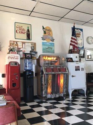 Vintage Coke vending machine, Wurlitzer jukebox, ice box.