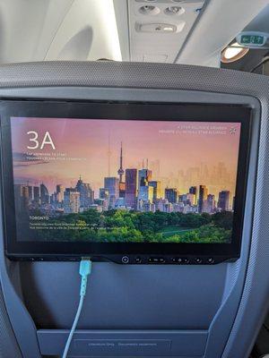 Business class from DEN to YYZ. Graphics are amazing. Toronto skyline. I'm charging my nearly dead phone.