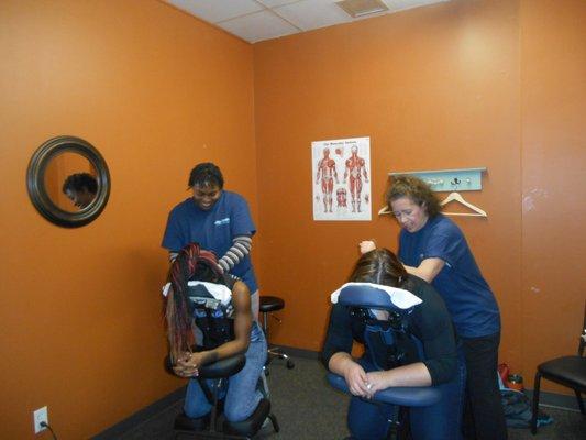 Tikiesha & Marie giving Chair Massages at our Grand Opening.