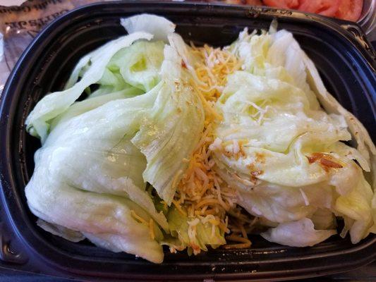 two large hunks of iceberg lettuce is salad? I removed the tomatoes, onion & gross chicken so you could see the salad