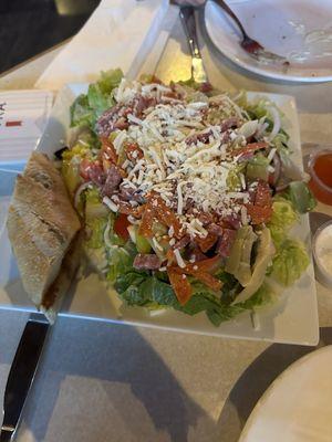 Antipasto salad with bread.