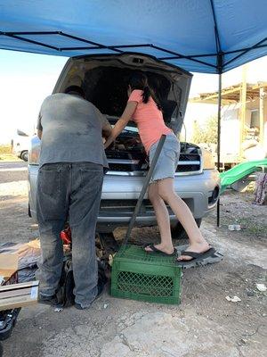 Working on a svu and teaching one of the mechanic kids