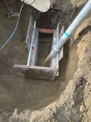 Dropping our trench box on a deep sewer repair!