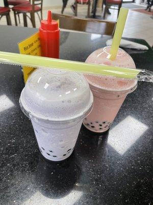 Bubble tea (1 Taro and 1 strawberry) with tapioca boba.