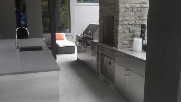 This picture of the concrete fire pit and outdoor kitchen is very elaborate, it was done for a baseball player here in Seattl...