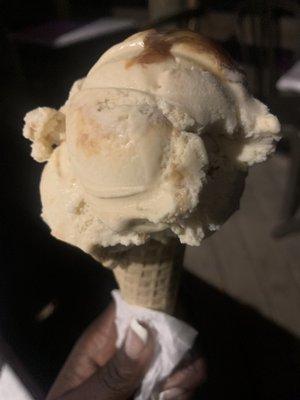 Salted caramel cheesecake ice cream on sugar cone