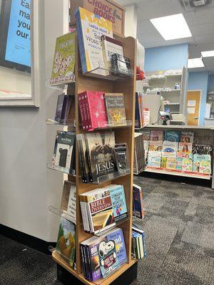 Quite a few Christian and inspirational books...magazines and puzzle books in the background.