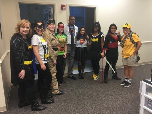 Our office's providers & staff dressed up for Halloween.