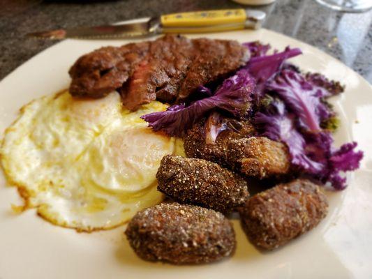 Steak and eggs with blue corn dusted tots.