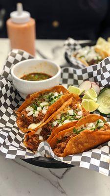 3 Birria tacos with melted cheese.